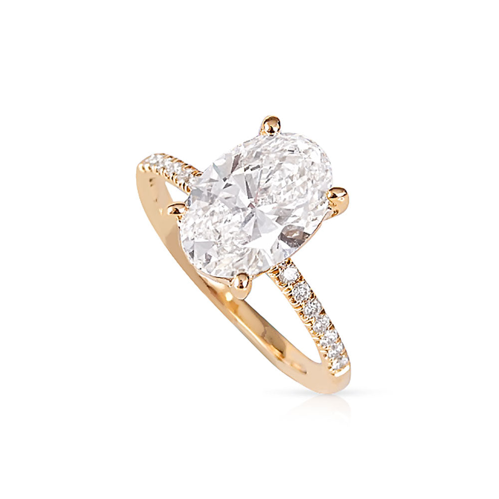 OVAL DIAMOND ENGAGEMENT RING WITH PAVE BAND