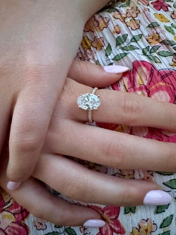 OVAL DIAMOND ENGAGEMENT RING WITH PAVE BAND