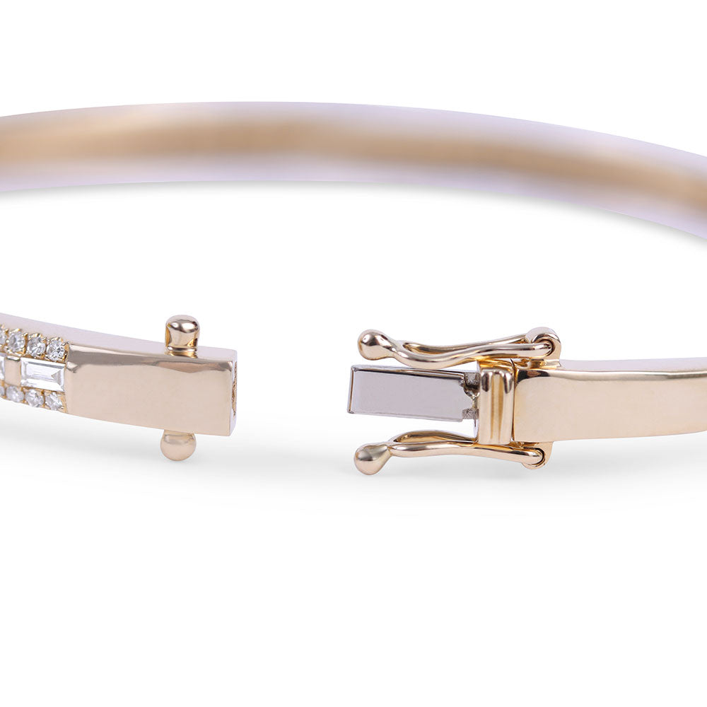 14K GOLD CIGAR BAND BANGLE WITH INSET BAGUETTE DIAMONDS