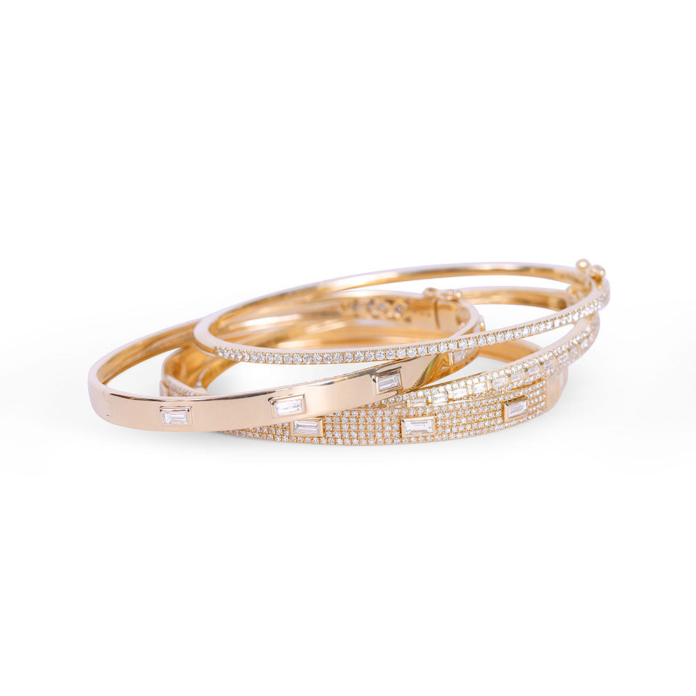 14K GOLD CIGAR BAND BRACELET WITH INSET BAGUETTE DIAMONDS