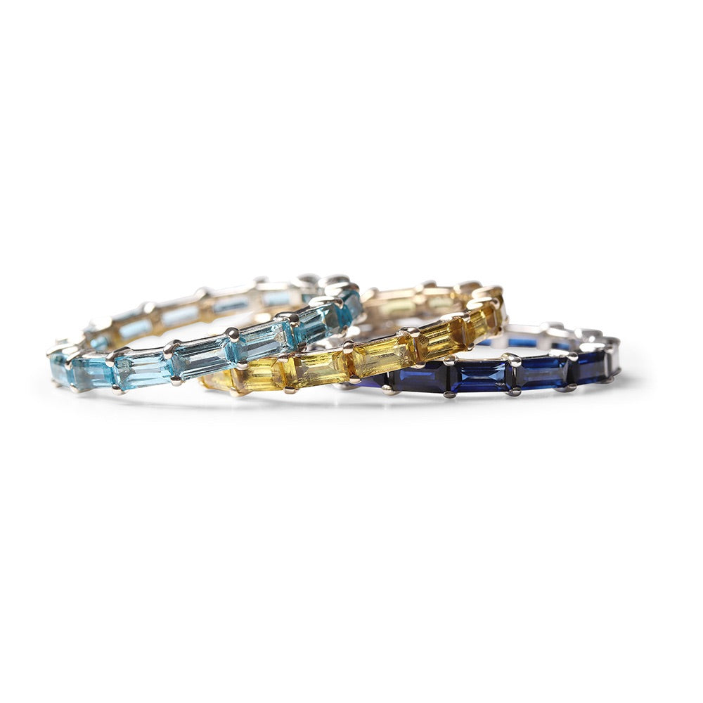 BLUE TOPAZ BAGUETTE ETERNITY RING