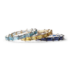 BLUE TOPAZ BAGUETTE ETERNITY RING